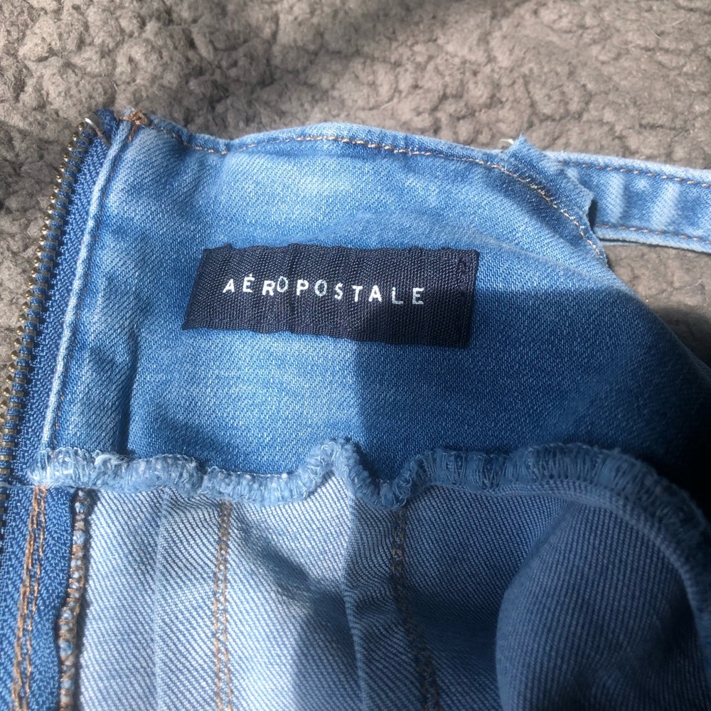 Never worn. Mid thigh length.